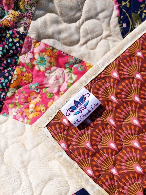 Handmade quilt Floral hopscotch border label close-up