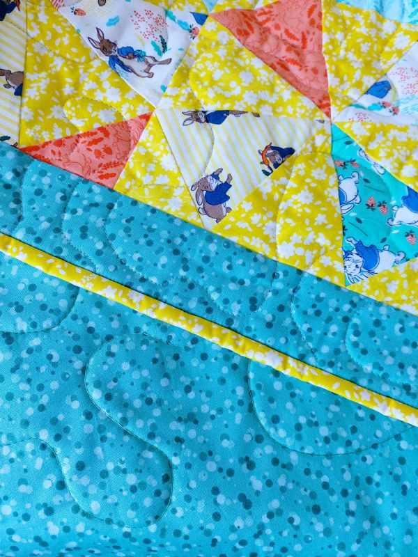 Handmade quilt Peter Rabbit kaleidoscope design close-up