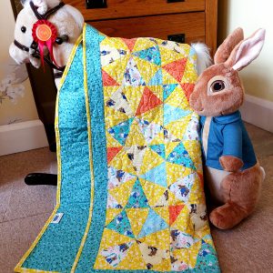 Handmade quilt Peter Rabbit kaleidoscope styled scene